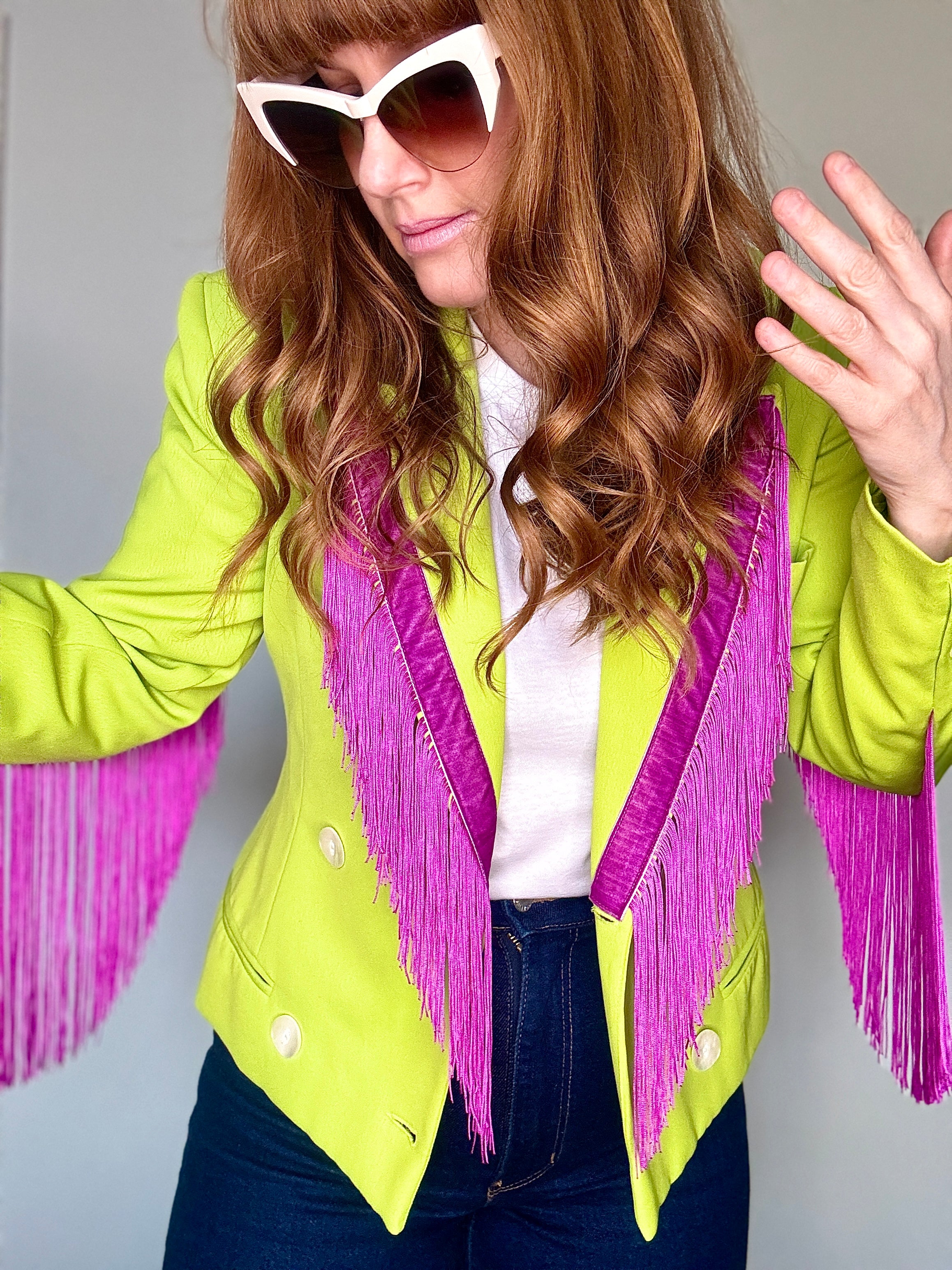 A woman wearing a lime and purple Dolly Blazer